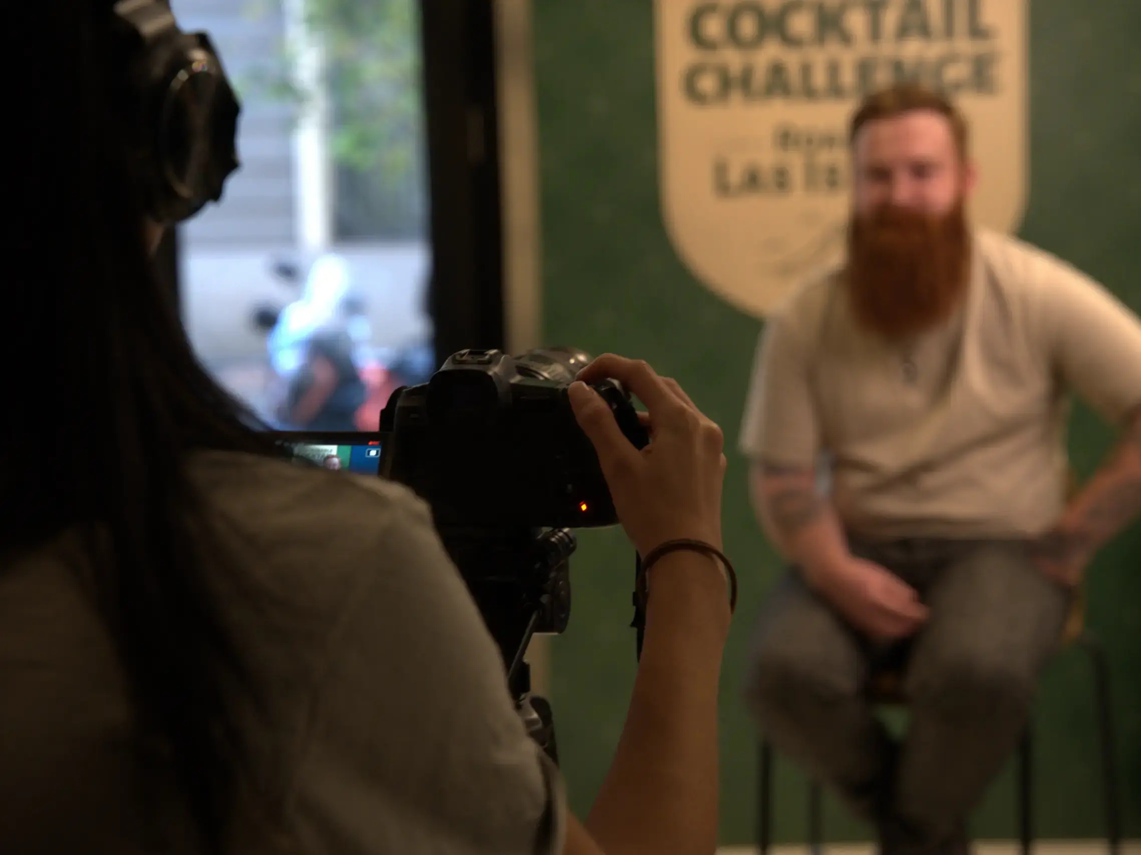 Videographer filming an interview during an experiential event – AQ Productions portfolio.